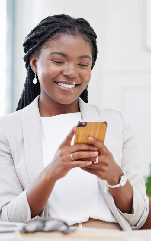 online-world-beckons-shot-beautiful-african-businesswoman-using-her-smartphone-send-text (1)
